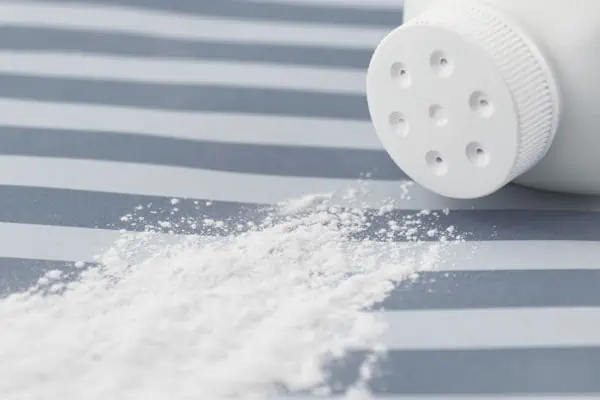 Bottle of Talcum Powder Pouring Out representing Toxins that are causing Ovarian Cancer