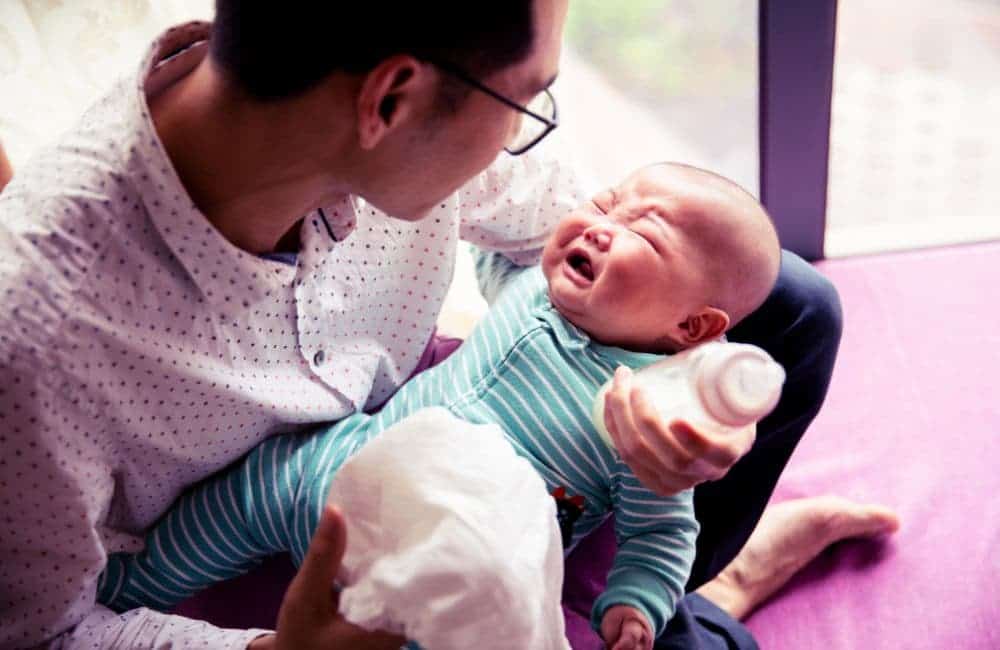 dad with crying baby