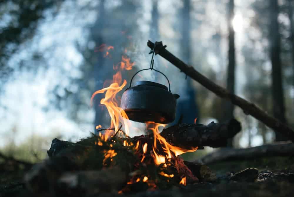 boiling water over a camp fire